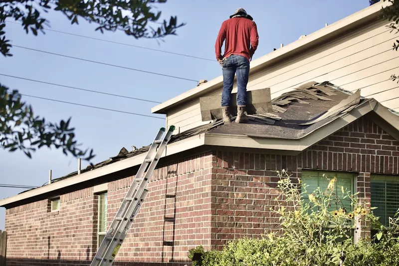 Professional roofer working on a residential roof in Joshua Tree